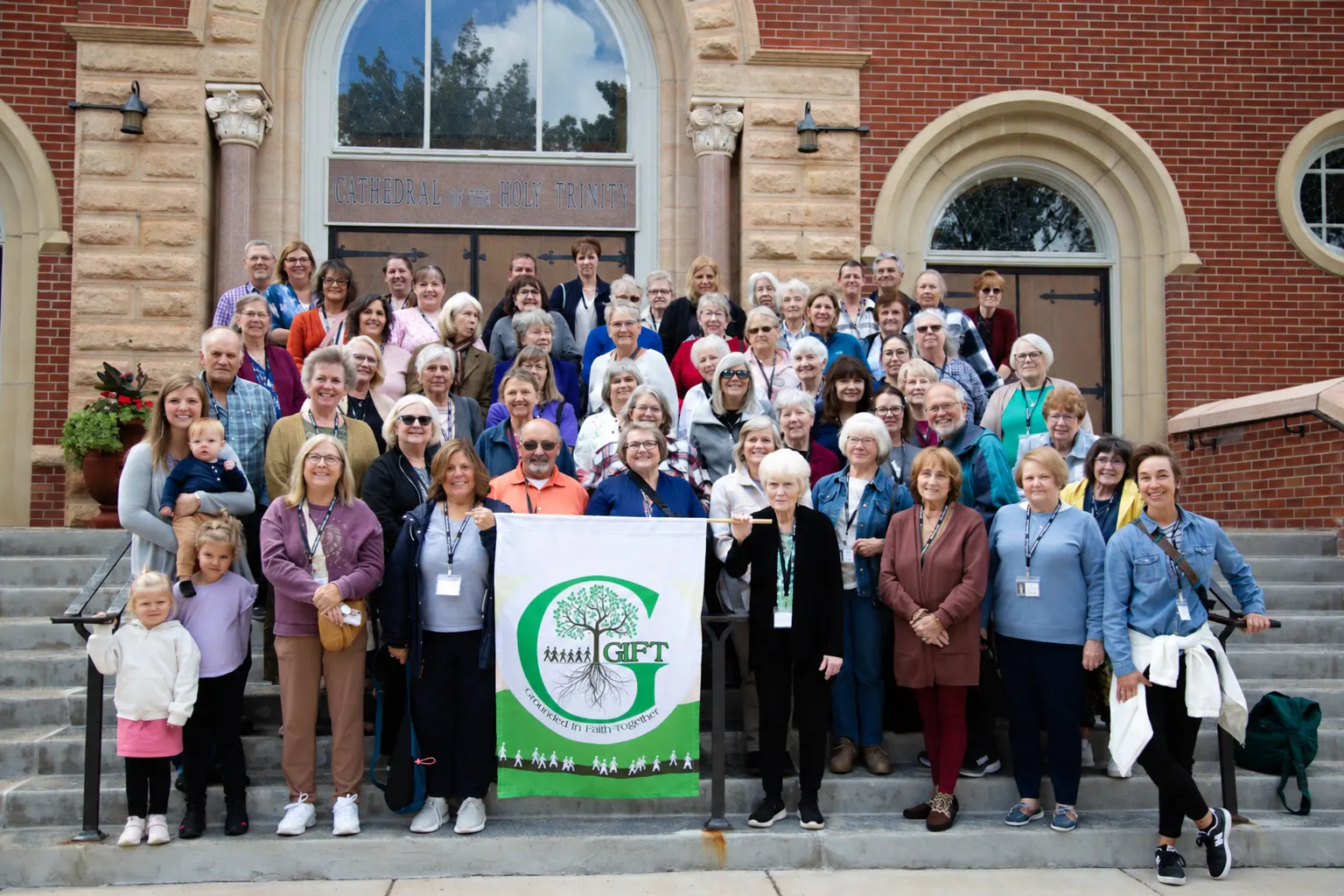 GIFT community group photo outside the Cathedral of the Holy Trinity